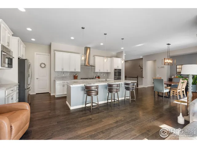 a open kitchen with cabinets a sink and a stove