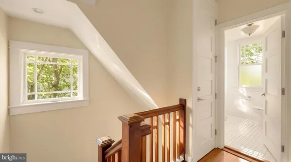 a view of a hallway with windows