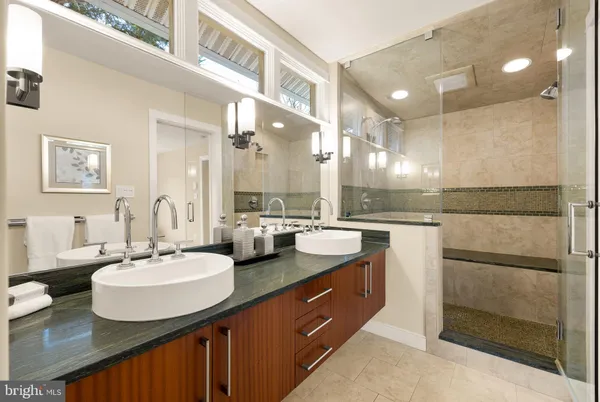 a bathroom with a sink double vanity and a mirror