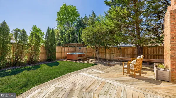a view of a backyard with sitting area