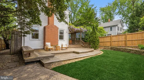 a front view of a house with a garden and yard