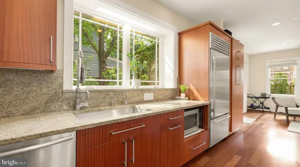 a kitchen with a sink and a window