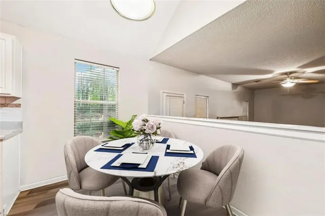 a view of a dining room with furniture window and outside view