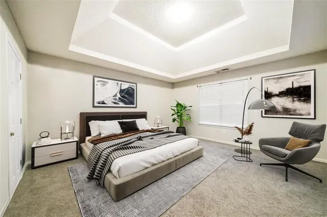 a bedroom with a bed and glass window