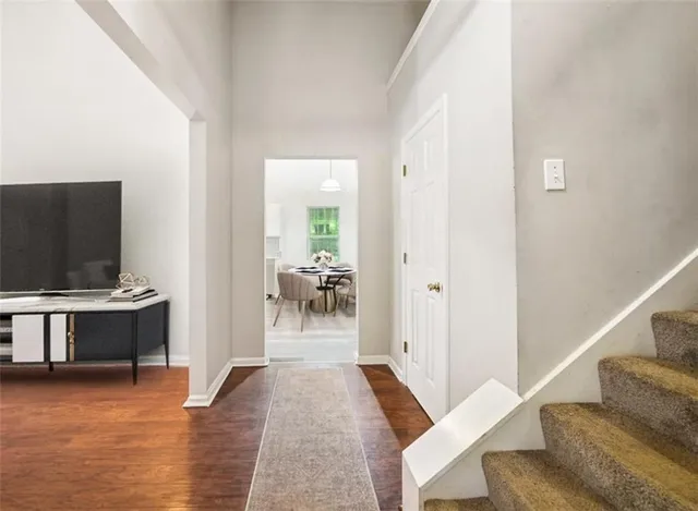 a view of a livingroom with furniture and hardwood floor