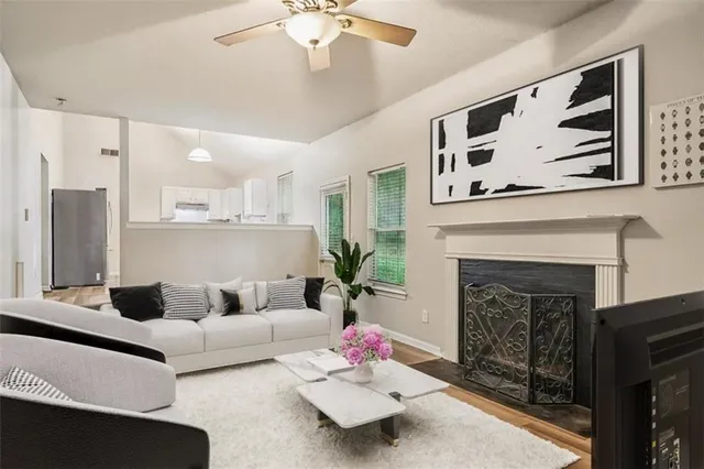 a living room with furniture and a fireplace
