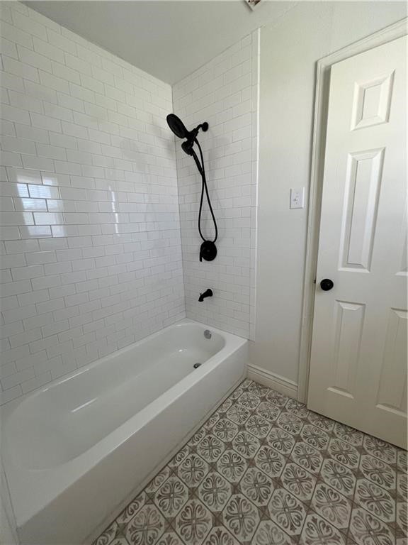 3662 Austin Street Corpus Christi, TX 78411 - Photo 10 of 22 a bathroom with a bath tub and a shower