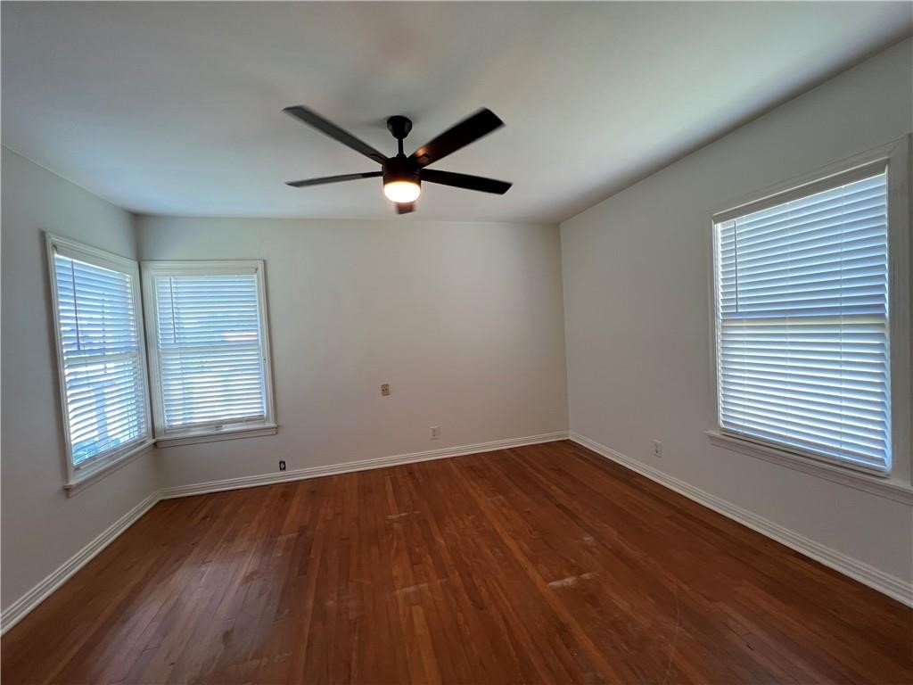 3662 Austin Street Corpus Christi, TX 78411 - Photo 11 of 22 wooden floor in an empty room with a window