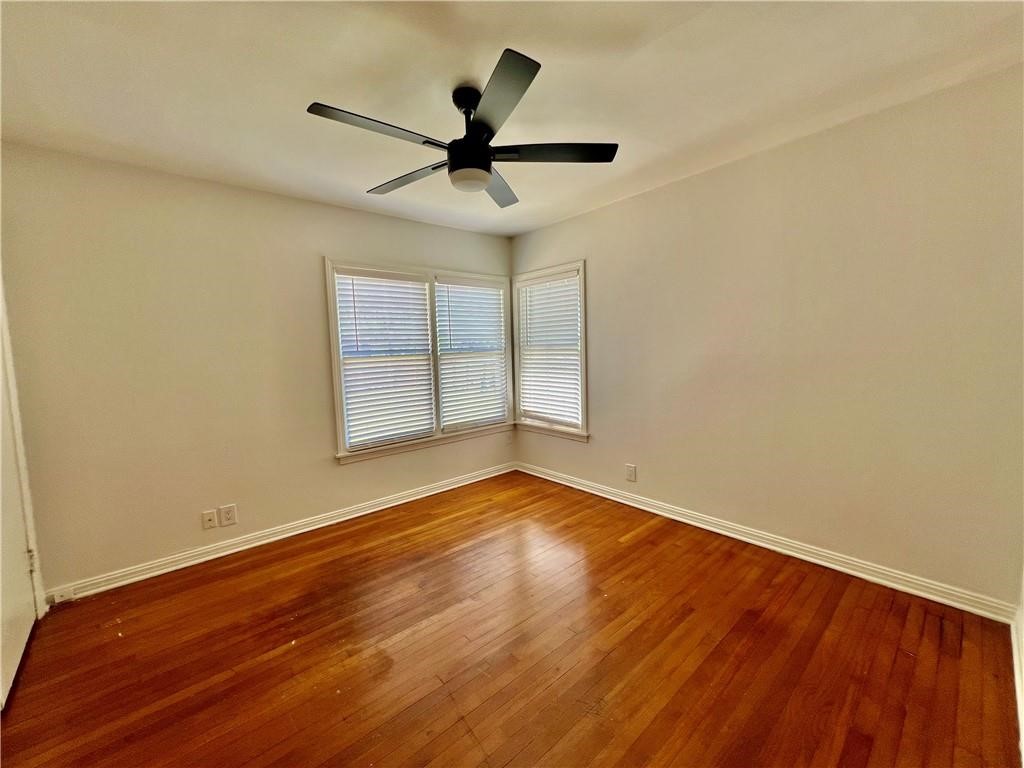 3662 Austin Street Corpus Christi, TX 78411 - Photo 12 of 22 a view of empty room with wooden floor and fan