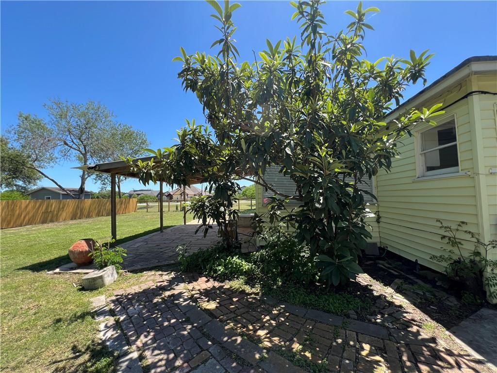 3662 Austin Street Corpus Christi, TX 78411 - Photo 17 of 22 a backyard of a house with lots of green space