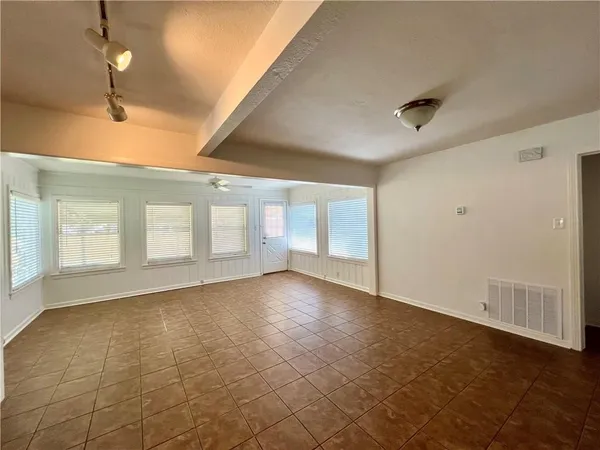 a view of a lake with houses in the back