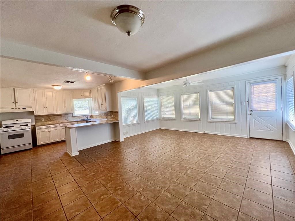 3662 Austin Street Corpus Christi, TX 78411 - Photo 22 of 22 a view of an empty room with kitchen and window