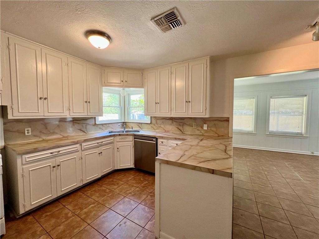 3662 Austin Street Corpus Christi, TX 78411 - Photo 5 of 22 a kitchen with a sink window and cabinets
