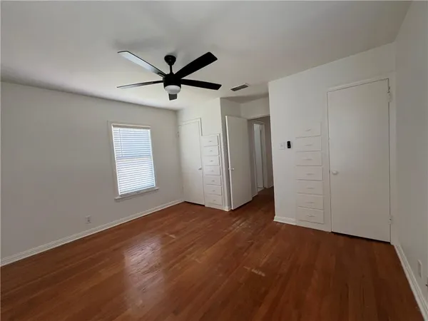 a kitchen with stainless steel appliances a refrigerator and a stove top oven