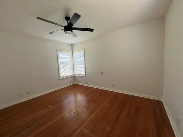 a kitchen with a sink window and cabinets