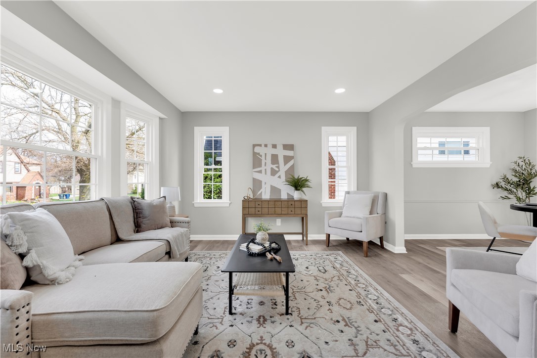 3964 Navahoe Road Cleveland Heights, OH 44121 - Photo 9 of 30 Living area featuring a wealth of natural light, light wood-style floors, and baseboards
