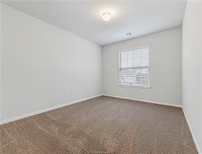 968 Rice Drive Bryan, TX 77803 - Photo 11 of 12 an empty room with windows