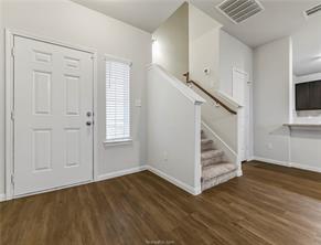 968 Rice Drive Bryan, TX 77803 - Photo 2 of 12 a view of entryway and hall with wooden floor