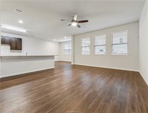 968 Rice Drive Bryan, TX 77803 - Photo 5 of 12 a view of an empty room with wooden floor and a window
