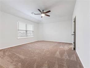 968 Rice Drive Bryan, TX 77803 - Photo 7 of 12 an empty room with windows and fan