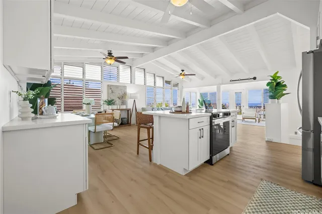 a kitchen with sink cabinets and wooden floor