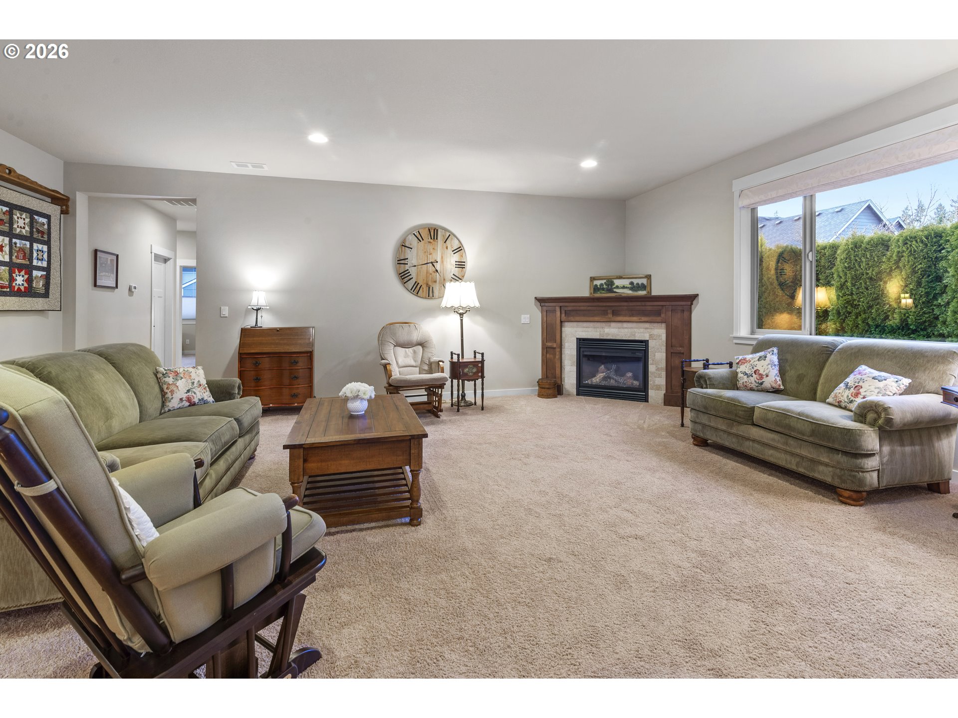 3110 Northeast 174th Street Ridgefield, WA 98642 - Photo 13 of 36 a living room with furniture and a fireplace
