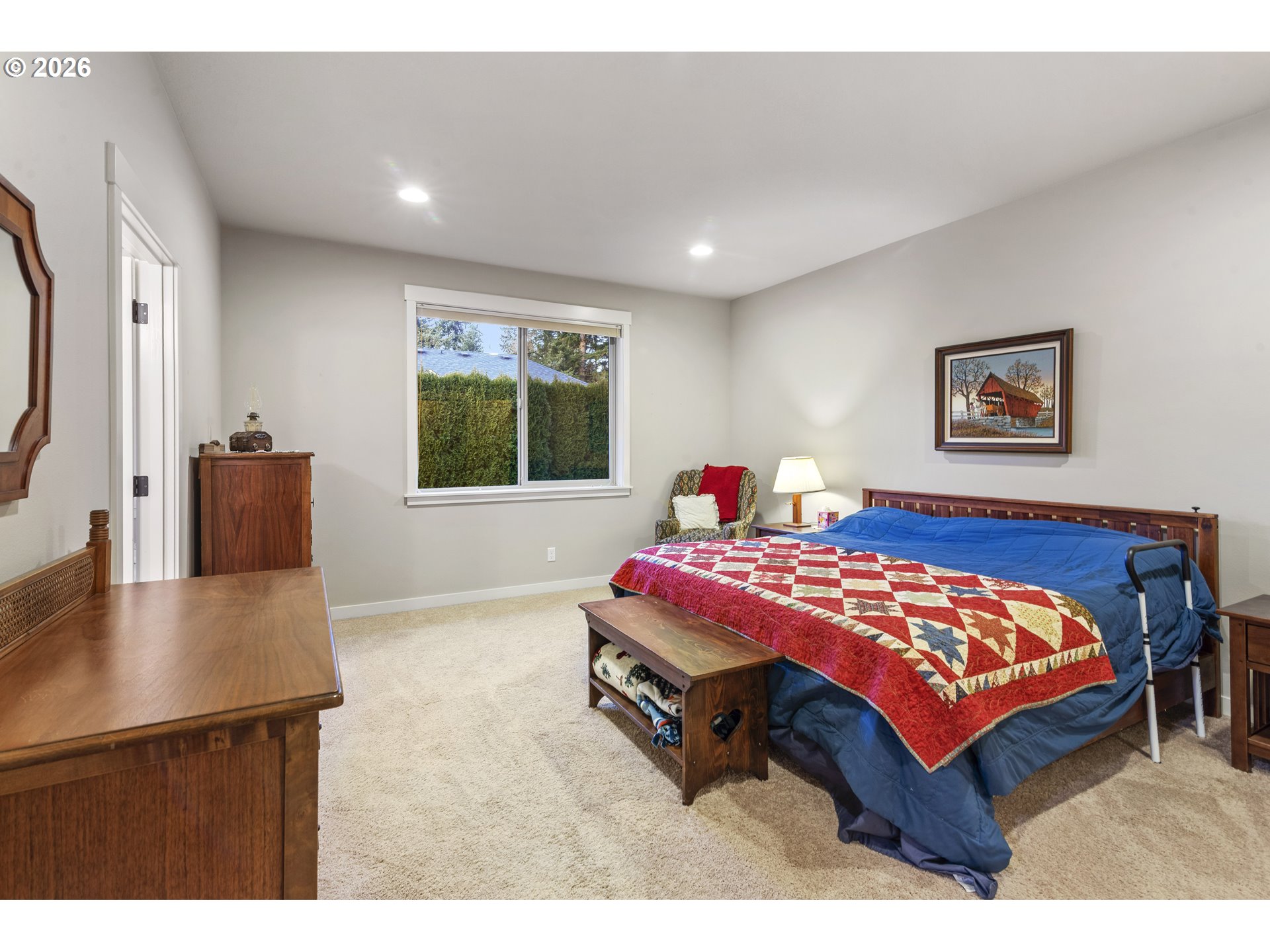 3110 Northeast 174th Street Ridgefield, WA 98642 - Photo 21 of 36 a bedroom with a bed and a table in it