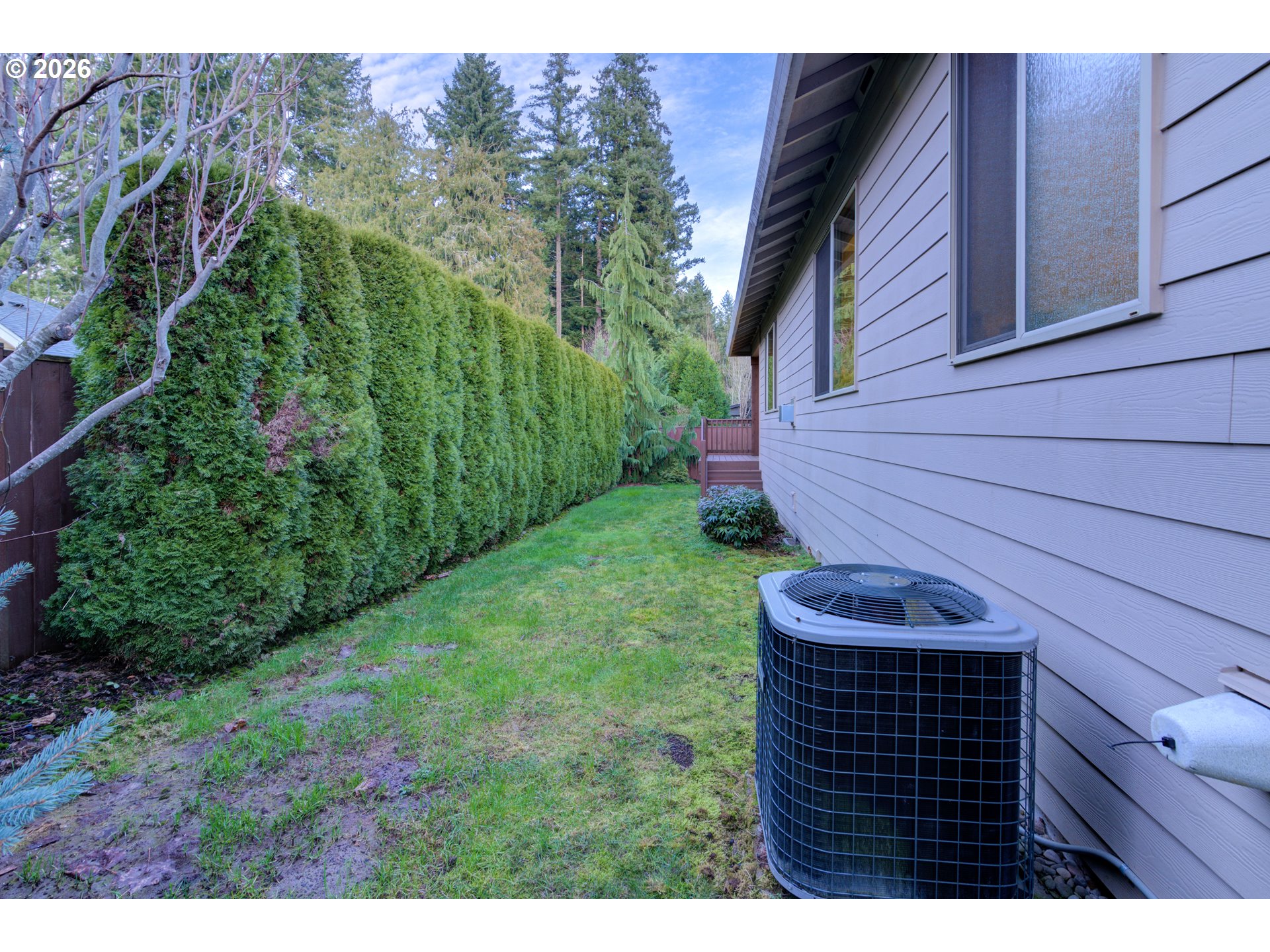 3110 Northeast 174th Street Ridgefield, WA 98642 - Photo 34 of 36 a view of a backyard with potted plants
