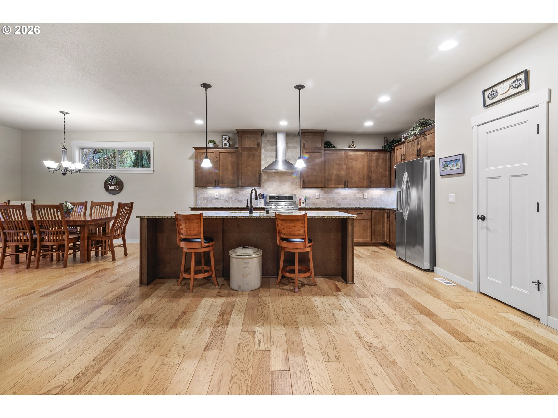 3110 Northeast 174th Street Ridgefield, WA 98642 - Photo 6 of 36 a kitchen with stainless steel appliances kitchen island a large island in the center