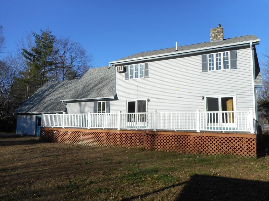 497 Main Road Milford, ME 04461 - Photo 2 of 35 Huge back deck and attractive chimney.