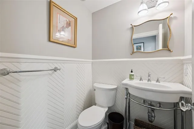 a view of a livingroom with furniture and a large window