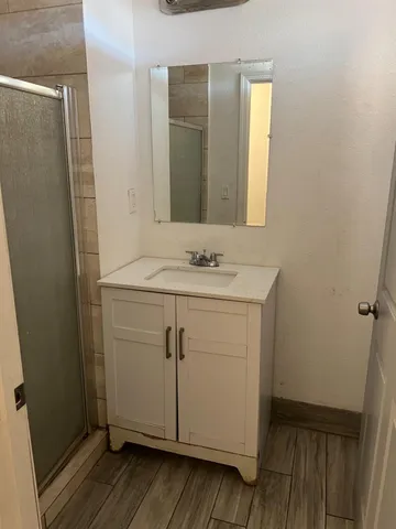 a bathroom with a sink and a mirror
