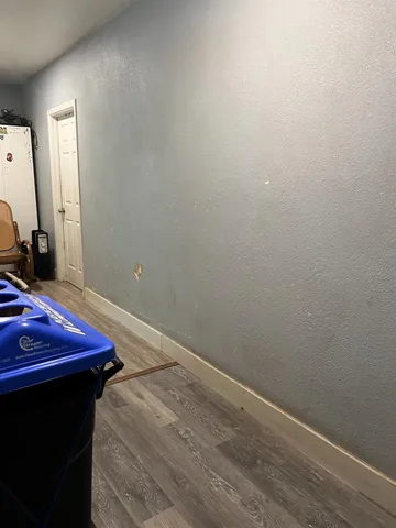 a room with a sink and a mirror