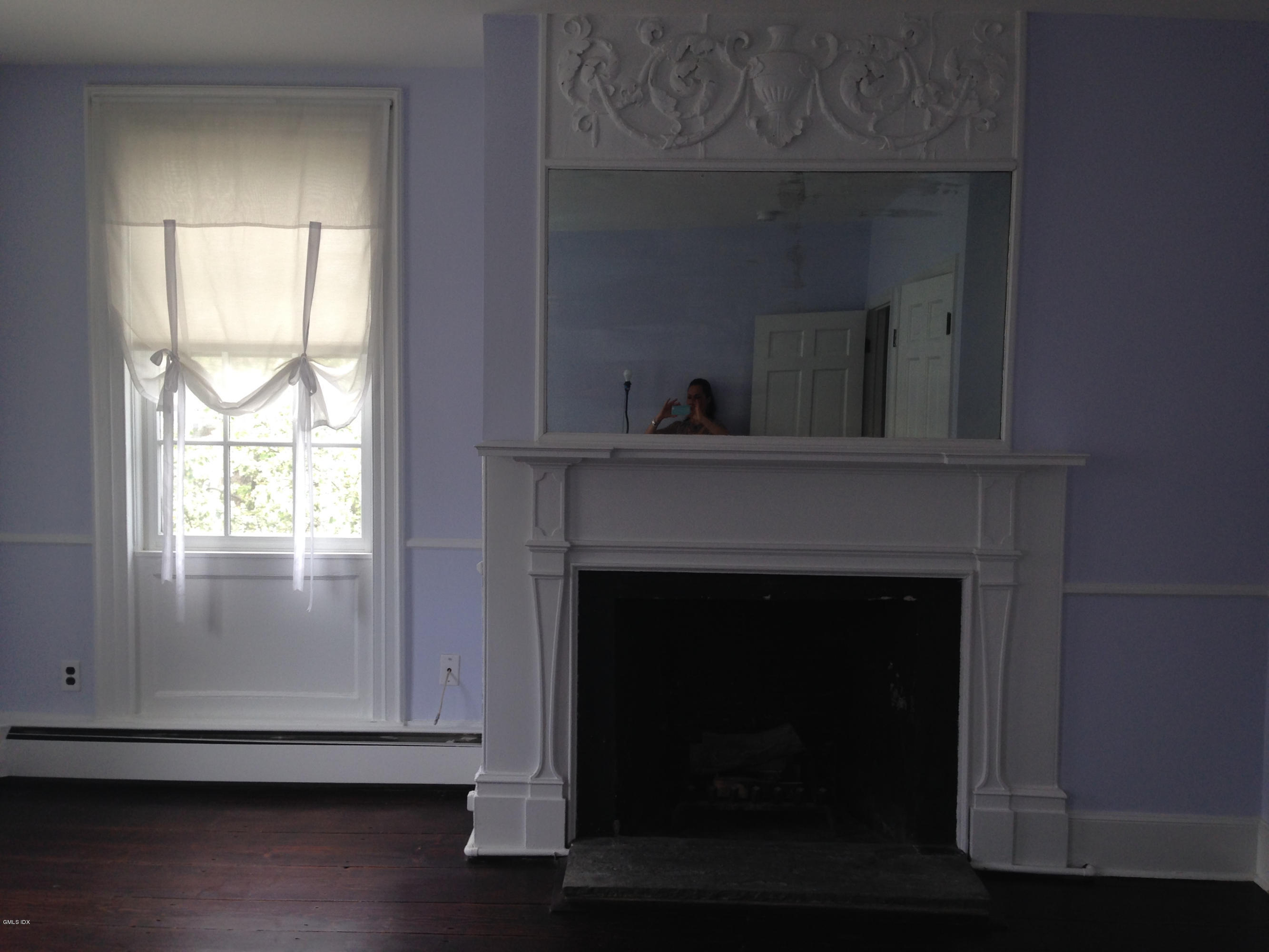 49 Valley Road, Unit A3 Cos Cob, CT 06807 - Photo 3 of 17 a living room with a fireplace