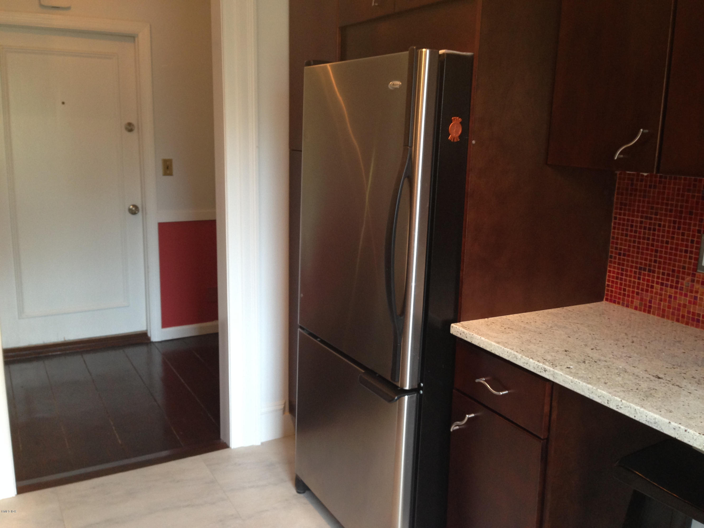 49 Valley Road, Unit A3 Cos Cob, CT 06807 - Photo 8 of 17 a kitchen with a refrigerator and a sink