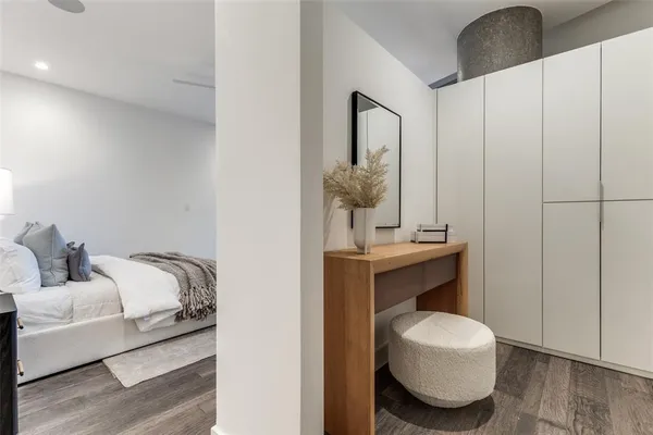 a living room with furniture and a mirror