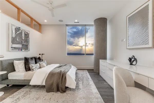 a bedroom with double bed and a window