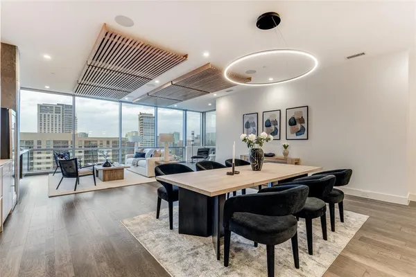 a view of a dining room with furniture and wooden floor