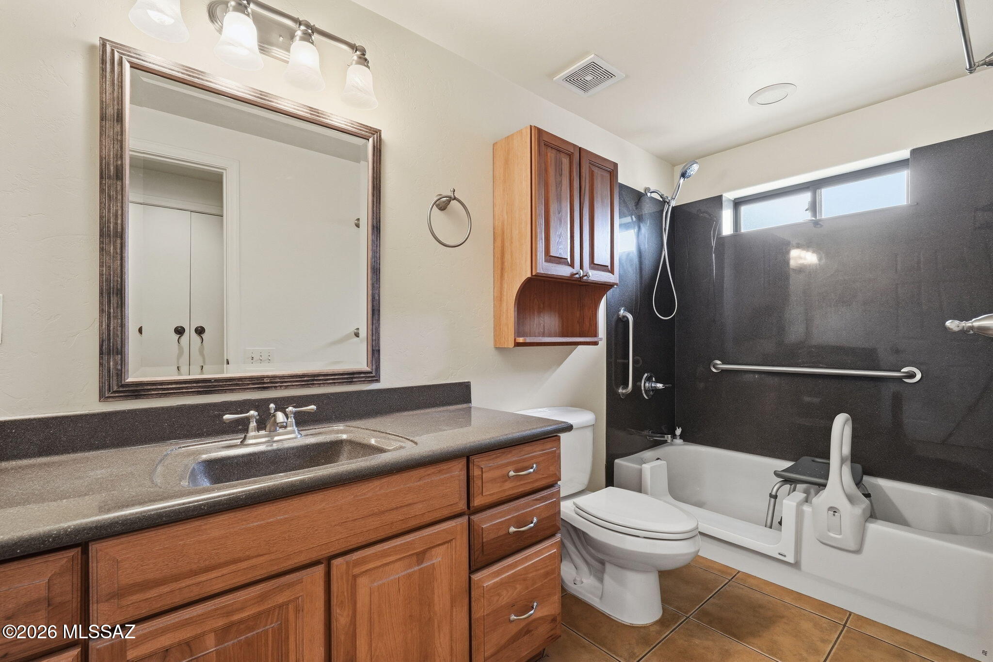 1125 East Kleindale Road Tucson, AZ 85719 - Photo 41 of 49 a bathroom with a sink a toilet and a mirror