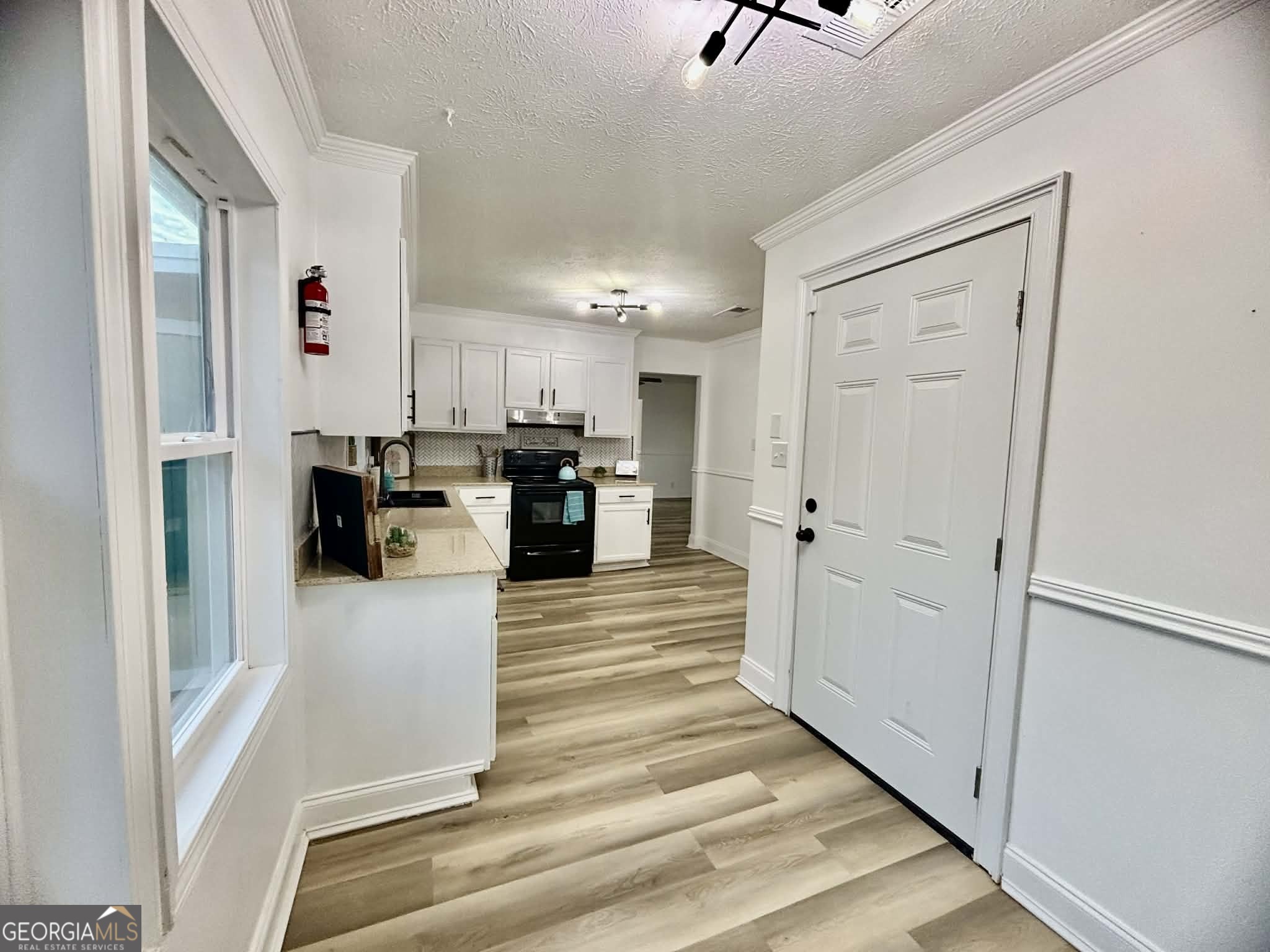 2800 South Estates Road Macon, GA 31216 - Photo 14 of 27 a view of kitchen with furniture and refrigerator