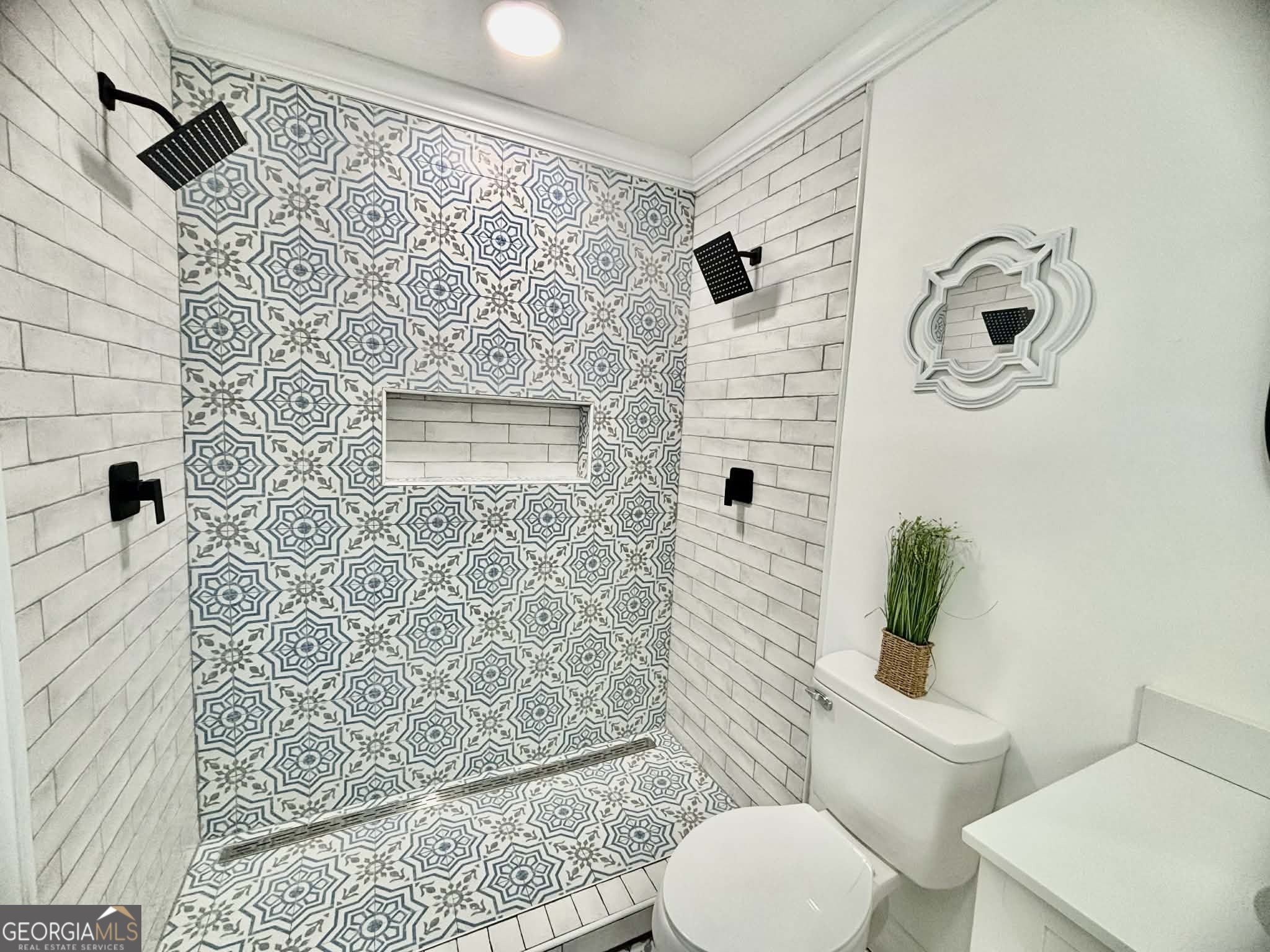 2800 South Estates Road Macon, GA 31216 - Photo 20 of 27 a bathroom with a toilet and a shower