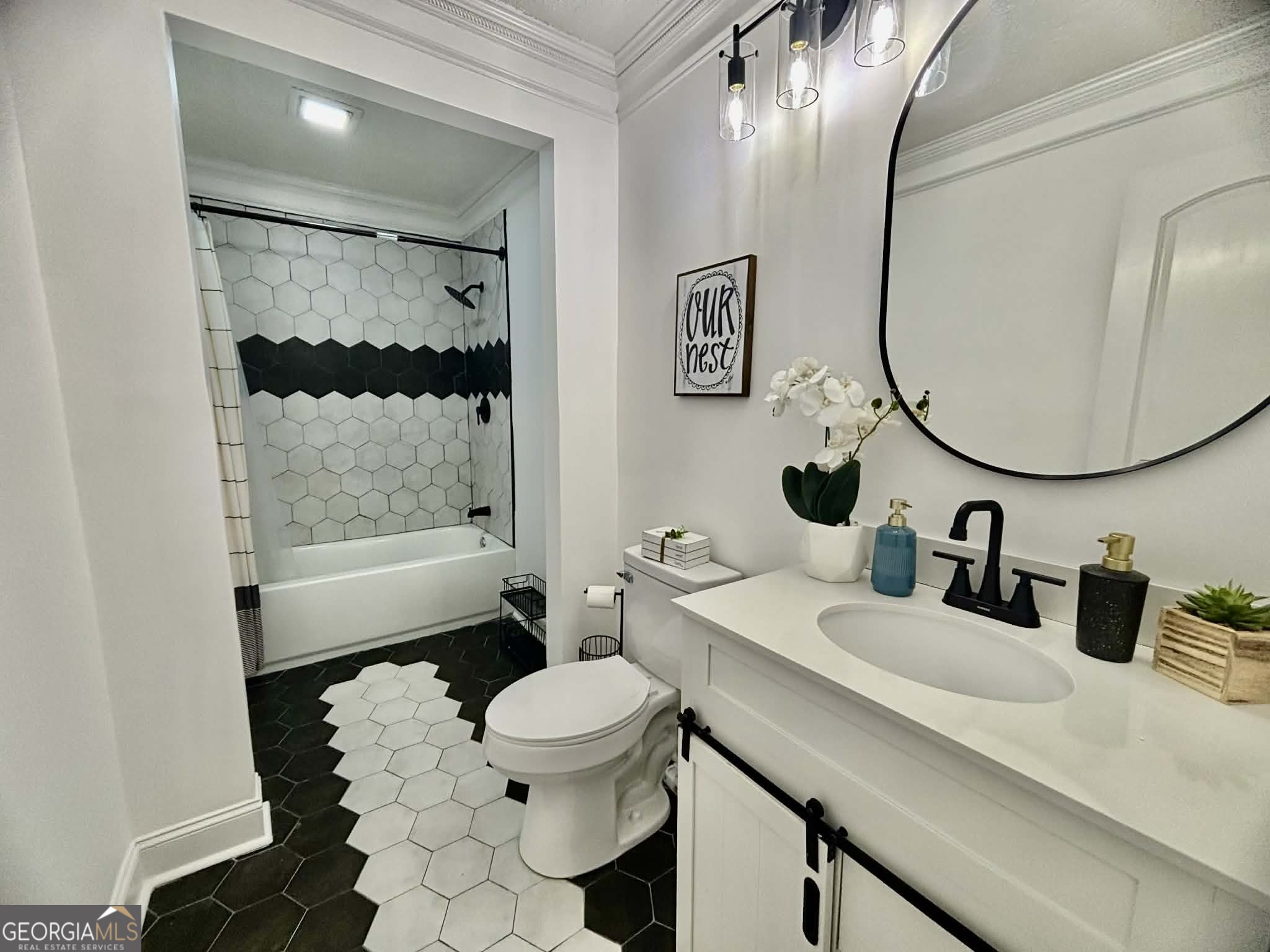 2800 South Estates Road Macon, GA 31216 - Photo 24 of 27 a bathroom with a double vanity sink toilet and shower
