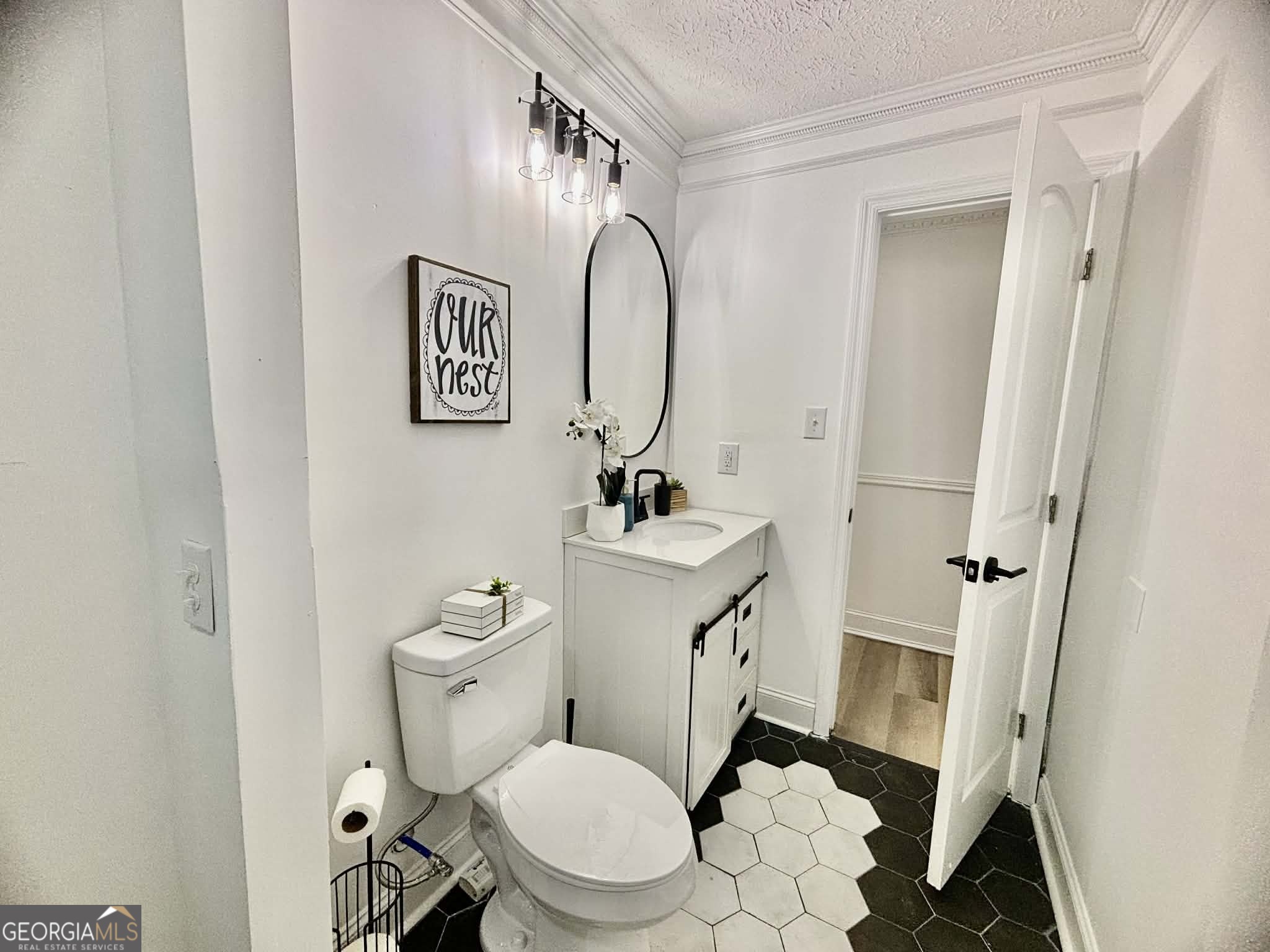 2800 South Estates Road Macon, GA 31216 - Photo 25 of 27 a bathroom with a toilet sink and mirror
