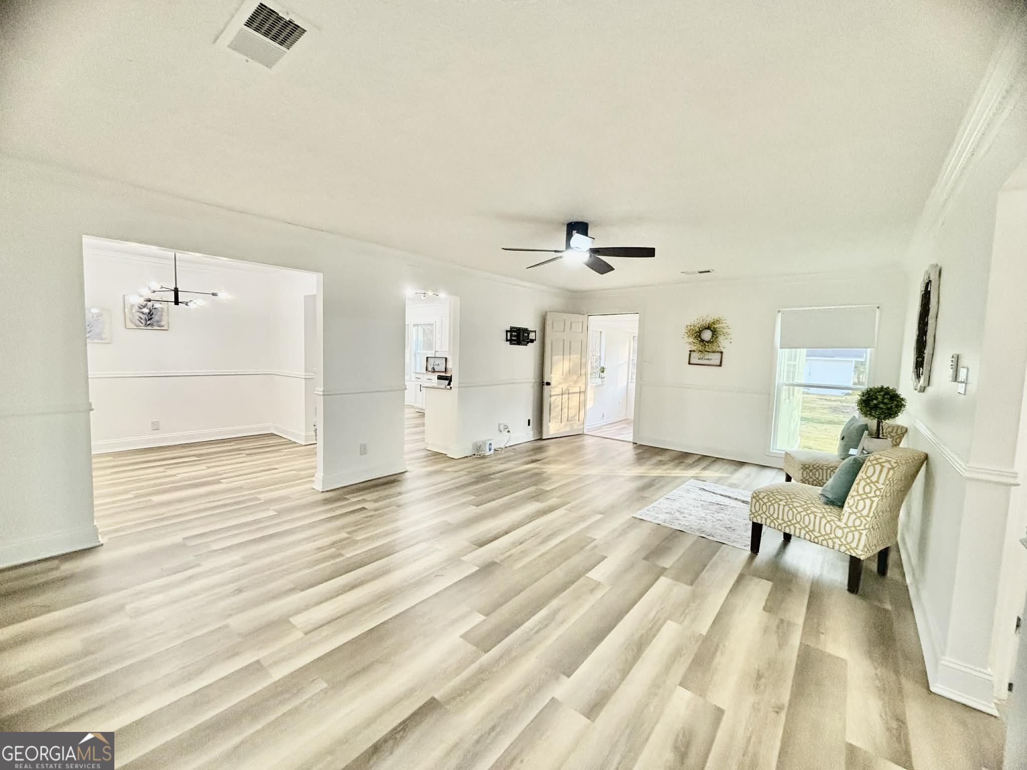 2800 South Estates Road Macon, GA 31216 - Photo 9 of 27 a view of a livingroom with wooden floor and a rug
