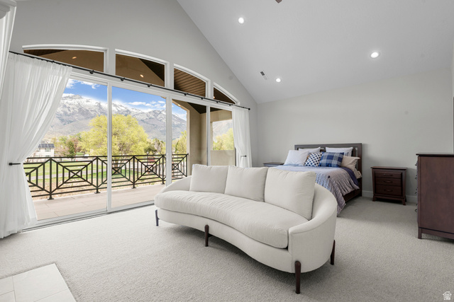 250 South Main Street, Unit 24 Alpine, UT 84004 - Photo 16 of 50 Bedroom featuring a mountain view, access to outside, multiple windows, light carpet, and vaulted ceiling