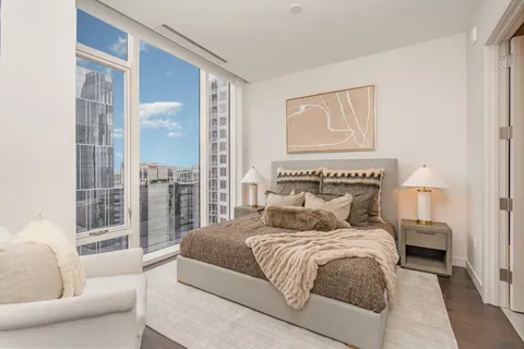 a bedroom with a large bed and a couch