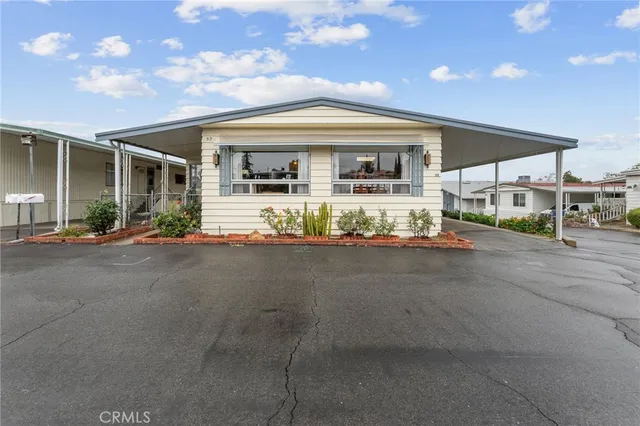 a front view of a house with basket ball court