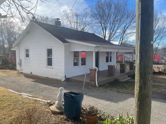 a view of a outdoor space with a patio and backyard