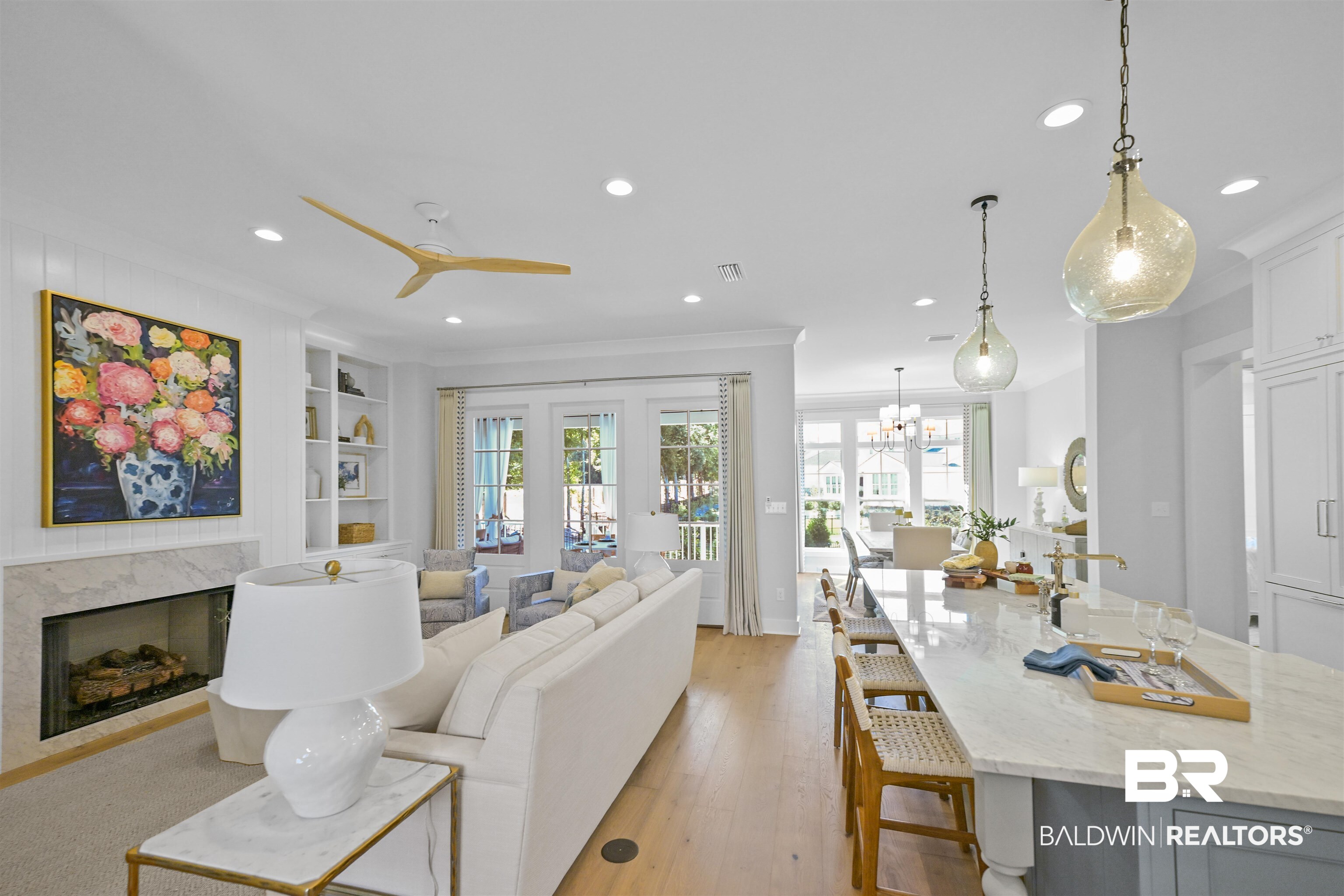 156 Hyacinth Street Fairhope, AL 36532 - Photo 21 of 61 Living room with light wood finished floors, recessed lighting, a fireplace, a ceiling fan, and a chandelier