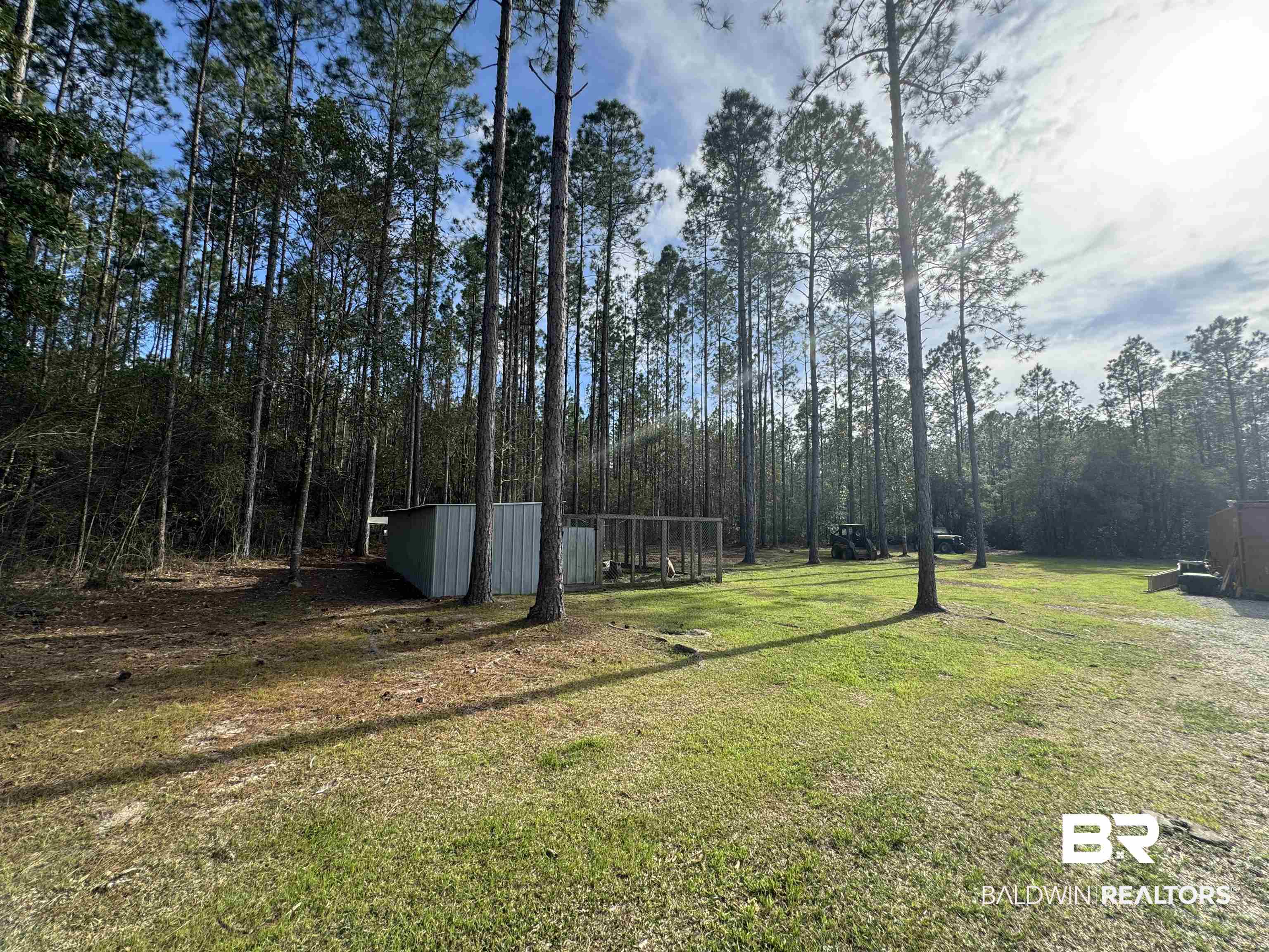 51235 Phillipsville Road Bay Minette, AL 36507 - Photo 49 of 63 View of green lawn featuring a pole building and an outbuilding